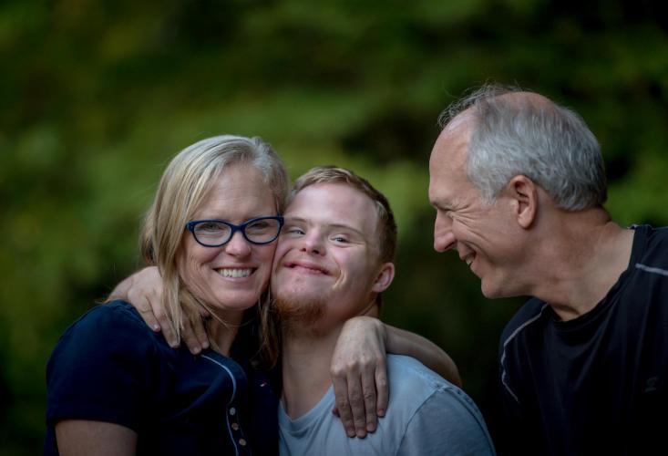 young man with parents